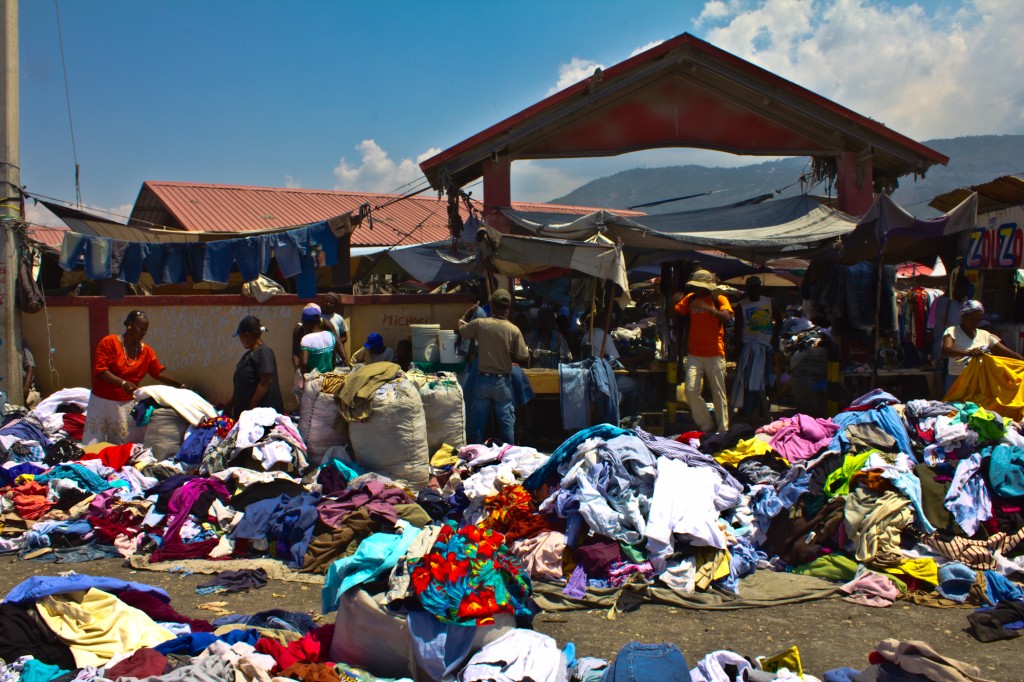 Merchants sort through piles of used t-shirts and other clothing shipped to Haiti and off loaded at Marche Croix-des-Bossales. "Made in Haiti" T-shirts are not hard to find. 