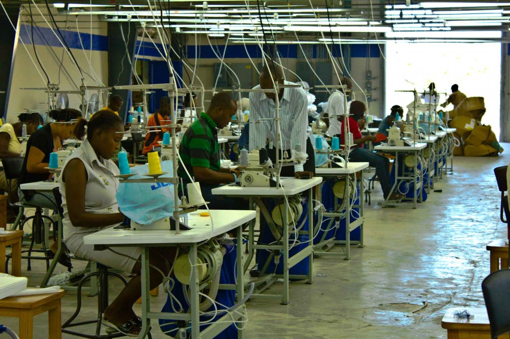 Workers make T-shirts for export in the SONAPI free-trade industrial zone on the outskirts of Port-au-Prince. Photo by Isabeau Doucet